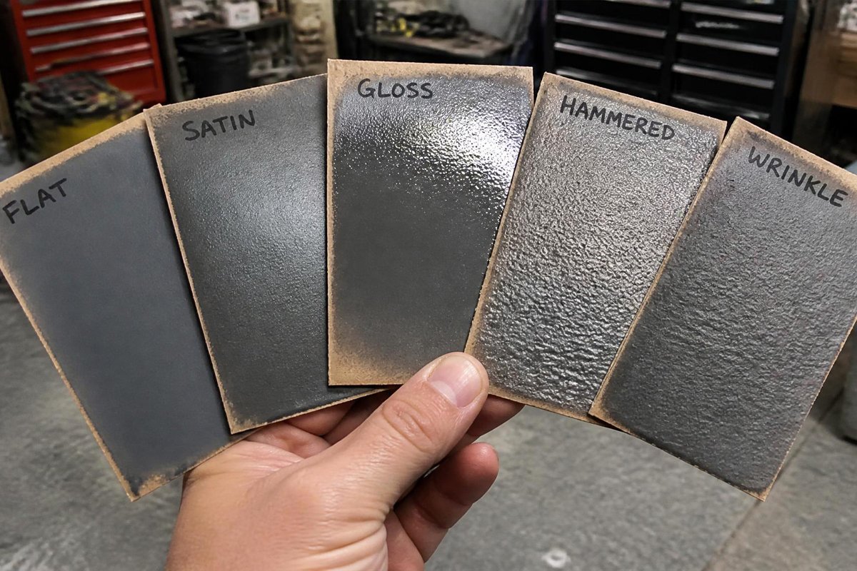 comparing spray paint types on test cardboard panels